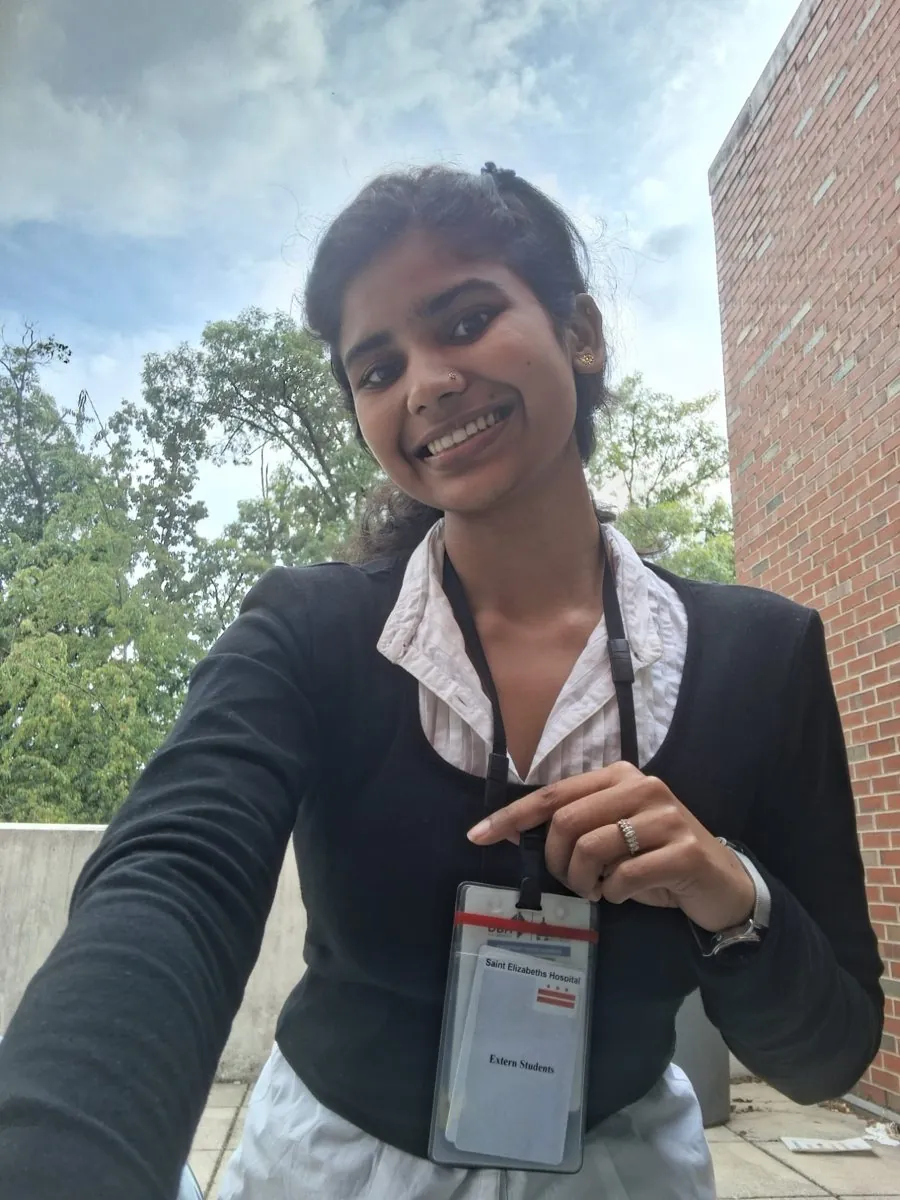 Dr. Aditi Pajiyar wearing her St. Elizabeths Hospital extern badge outside the hospital